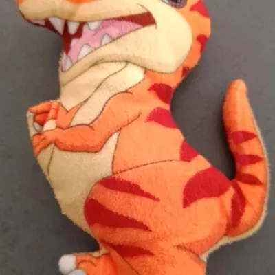 Petite peluche dinosaure orange